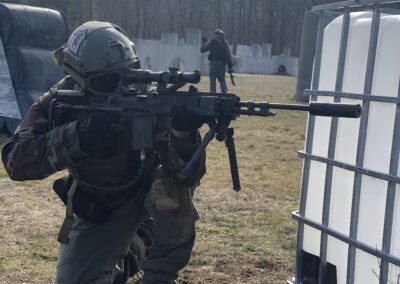 Airsoft player lining up her next shot at Cousins Paintball